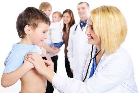 the doctor examines a child with worms